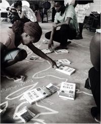 Staff from YWAM Blantyre, Malawi, pray for Bible distribution